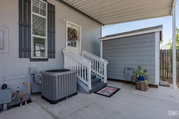 a view of porch with a bench
