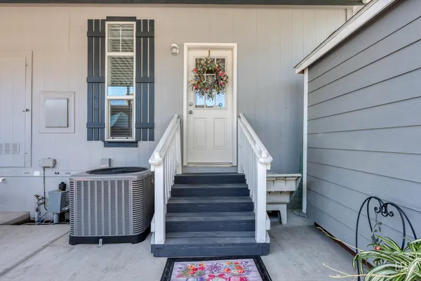 a view of entryway with stairs and wooden floor