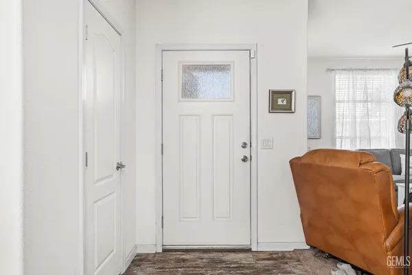 a living room with a couch and a window