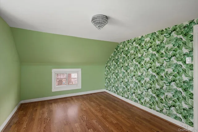 a view of a wooden floor and a window