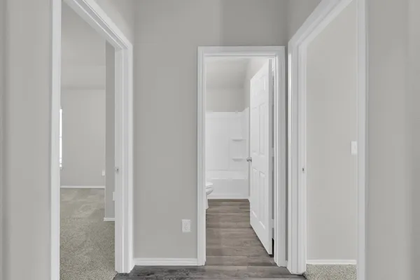 a view of a bathroom from the hallway