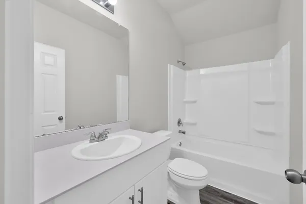 a bathroom with a sink toilet tub and shower
