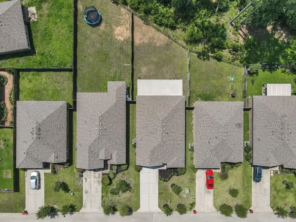 an aerial view of houses with outdoor space