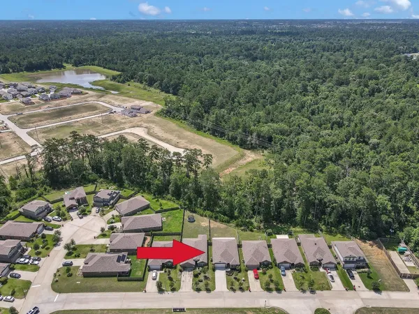 an aerial view of residential houses with outdoor space