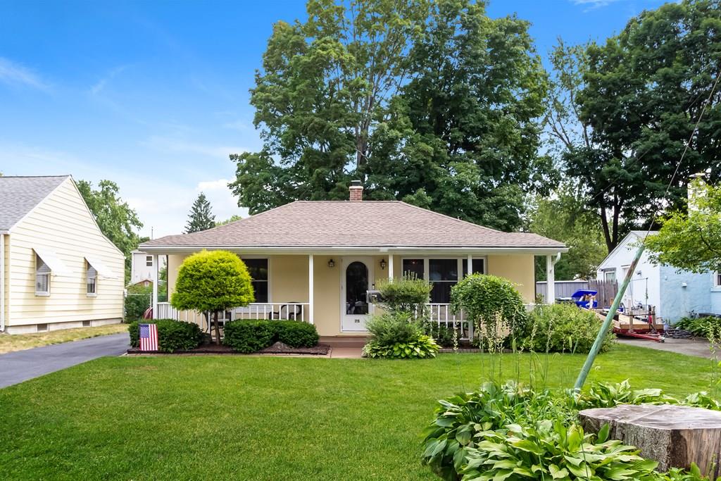 75 Garland Street Springfield, MA 01118 - Photo 1 of 32 a front view of a house with garden