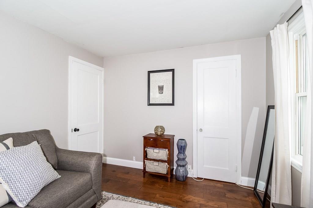 75 Garland Street Springfield, MA 01118 - Photo 22 of 32 a living room with furniture and a wooden floor