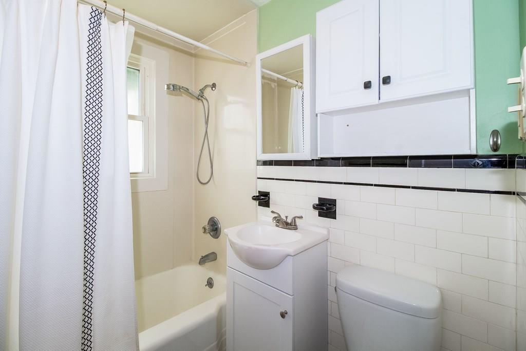 75 Garland Street Springfield, MA 01118 - Photo 25 of 32 a bathroom with a sink a toilet and shower