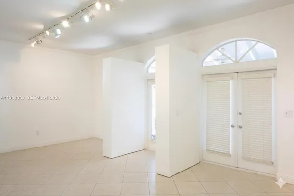 a kitchen with stainless steel appliances kitchen island granite countertop a refrigerator and a stove top oven