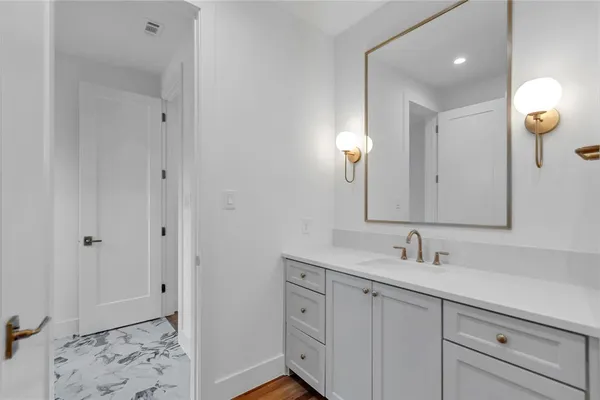a bathroom with a sink bathtub and a toilet