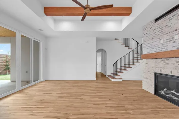 a bathroom with a granite countertop sink a toilet and a mirror