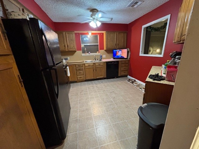 1908 Chelsea Court Rosenberg, TX 77471 - Photo 2 of 9 a kitchen with stainless steel appliances a refrigerator sink and microwave