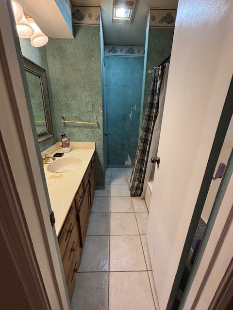 1908 Chelsea Court Rosenberg, TX 77471 - Photo 3 of 9 a bathroom with a sink a toilet and a mirror