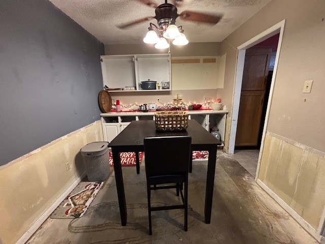 1908 Chelsea Court Rosenberg, TX 77471 - Photo 8 of 9 a view of a dining room with furniture and a chandelier fan