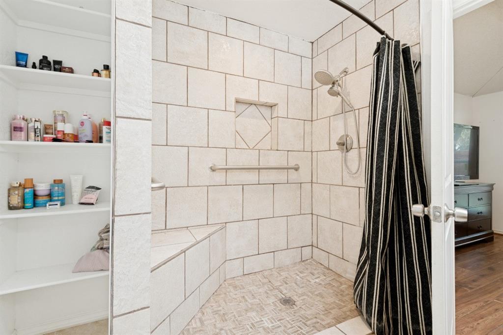 7410 Jessica Way Rowlett, TX 75088 - Photo 23 of 25 a bathroom with a shower
