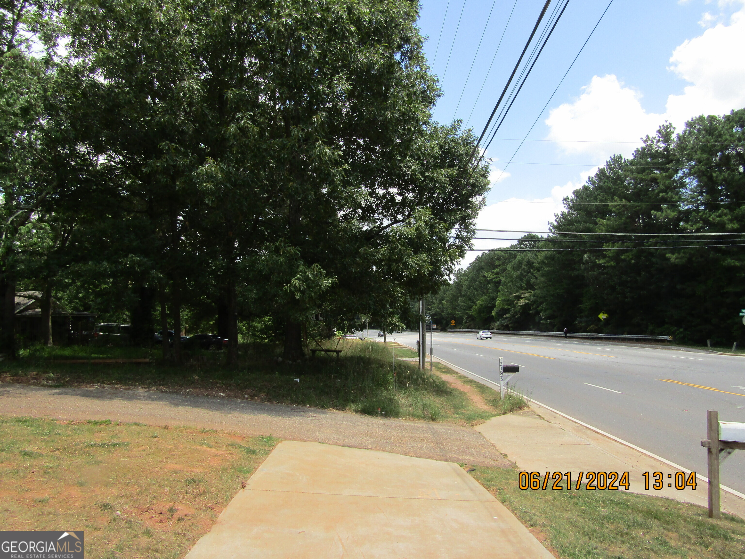 2169 Panola Road Lithonia, GA 30058 - Photo 5 of 10 a view of swimming pool with lawn chairs and iron fence