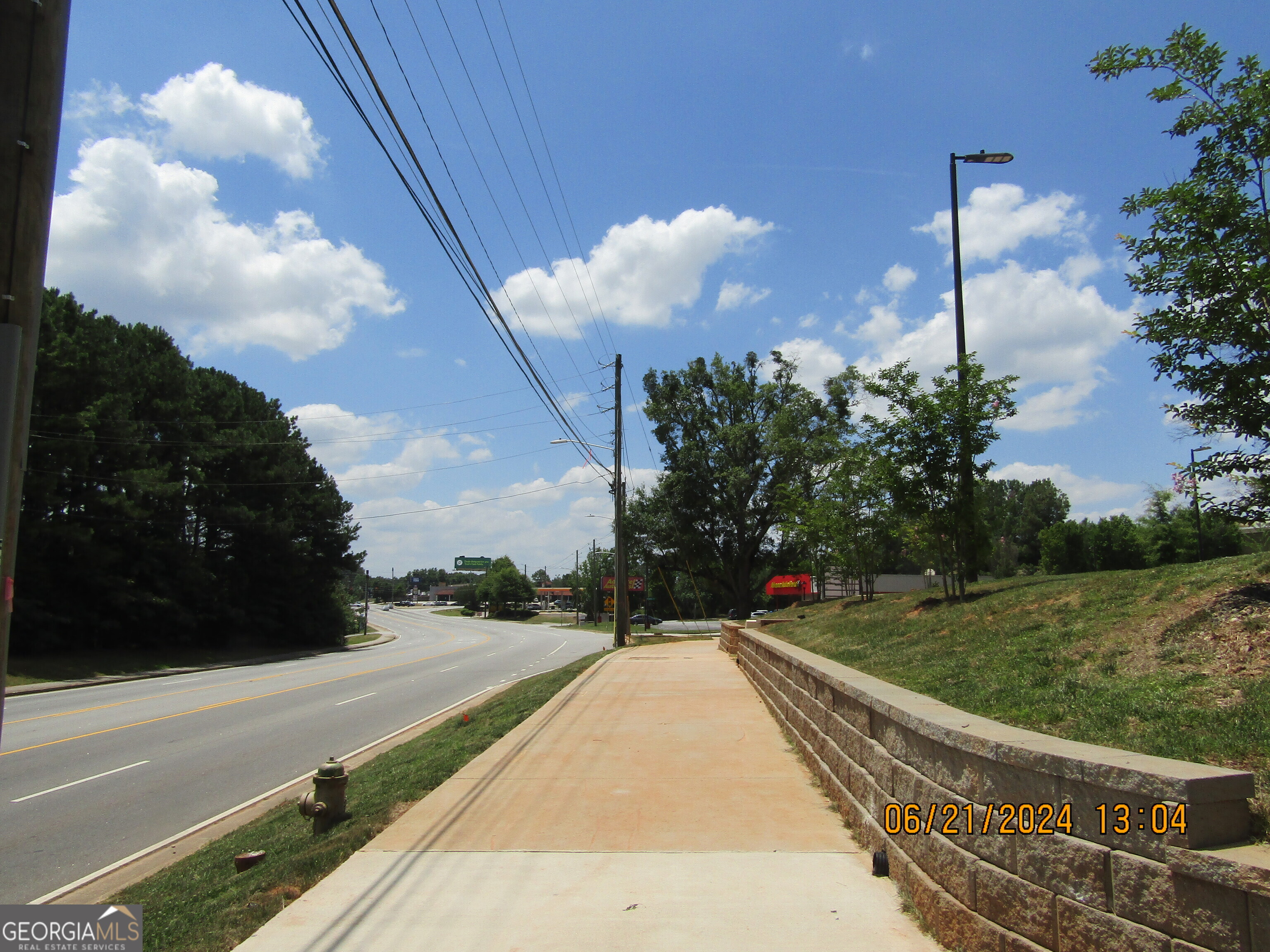 2169 Panola Road Lithonia, GA 30058 - Photo 8 of 10 a view of a pathway both side of building