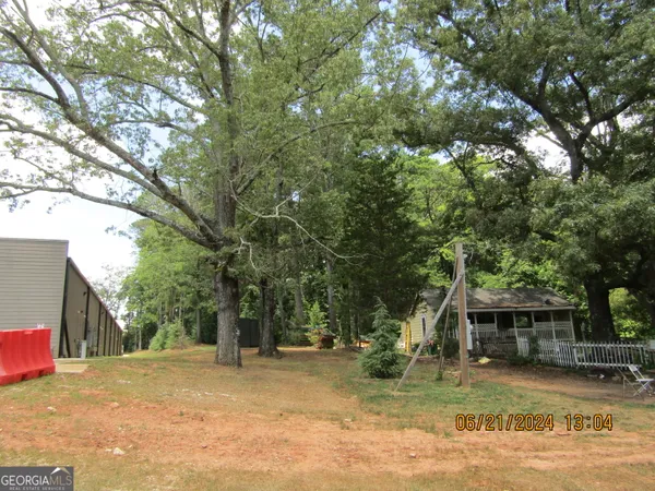a house with trees in the background