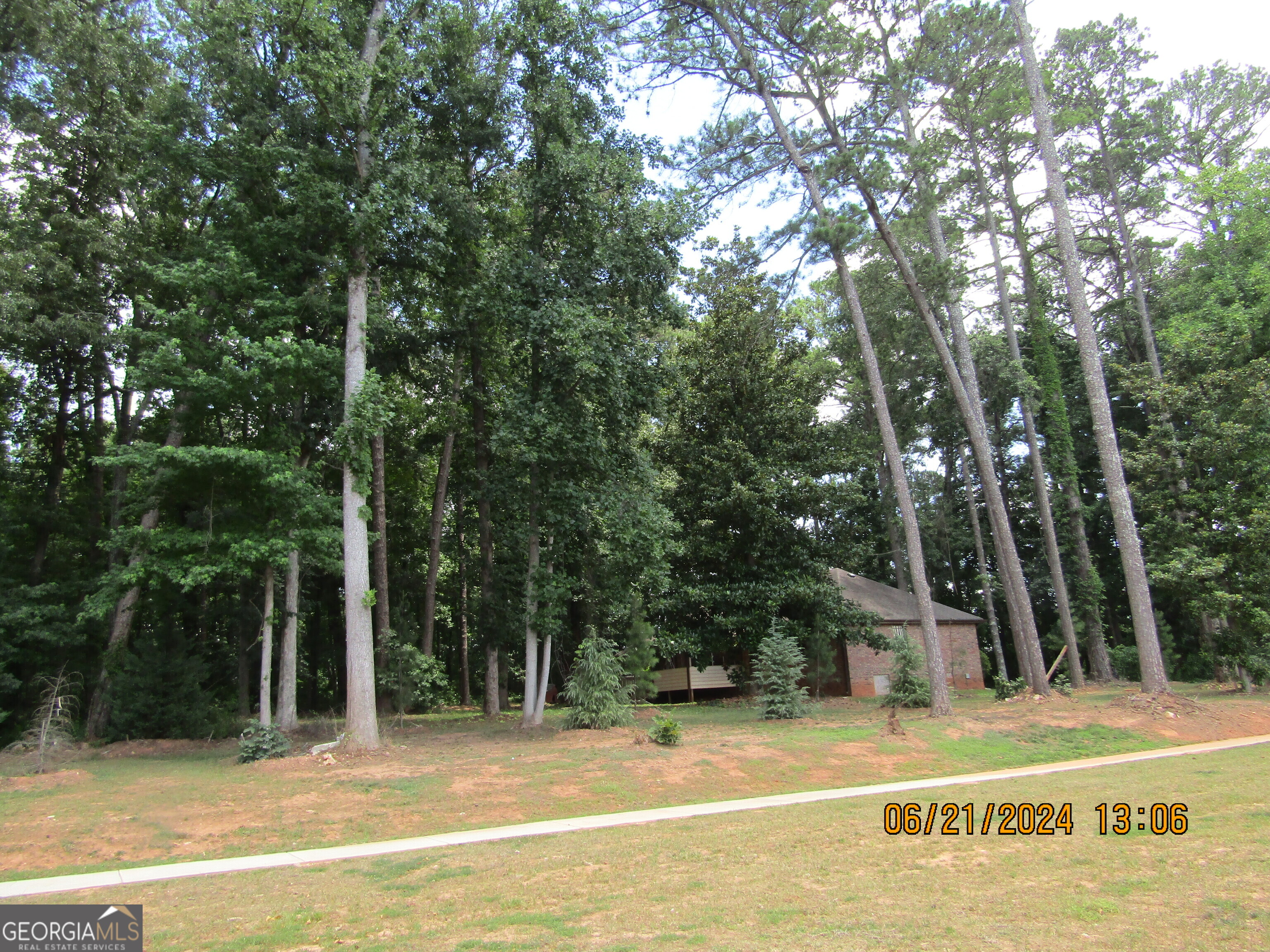 2169 Panola Road Lithonia, GA 30058 - Photo 10 of 10 a view of a house with a yard and large trees