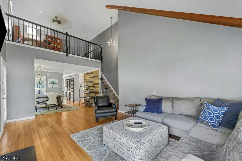 100 Easedale Road, Unit 100 Wayne, NJ 07470 - Photo 10 of 43 a living room with furniture and wooden floor