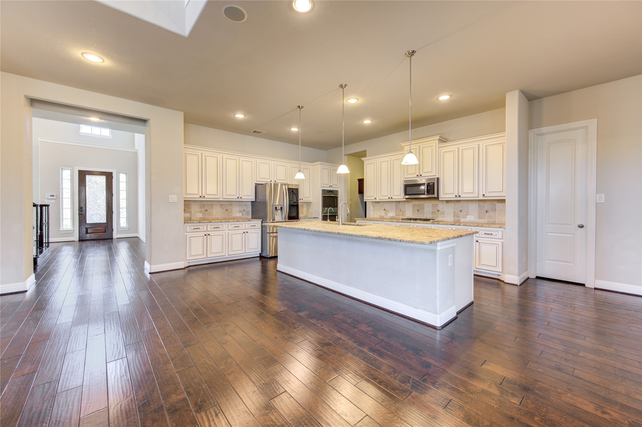 20411 Fawn Rest Place Spring, TX 77379 - Photo 13 of 50 a large kitchen with stainless steel appliances granite countertop a large counter top a sink and a refrigerator