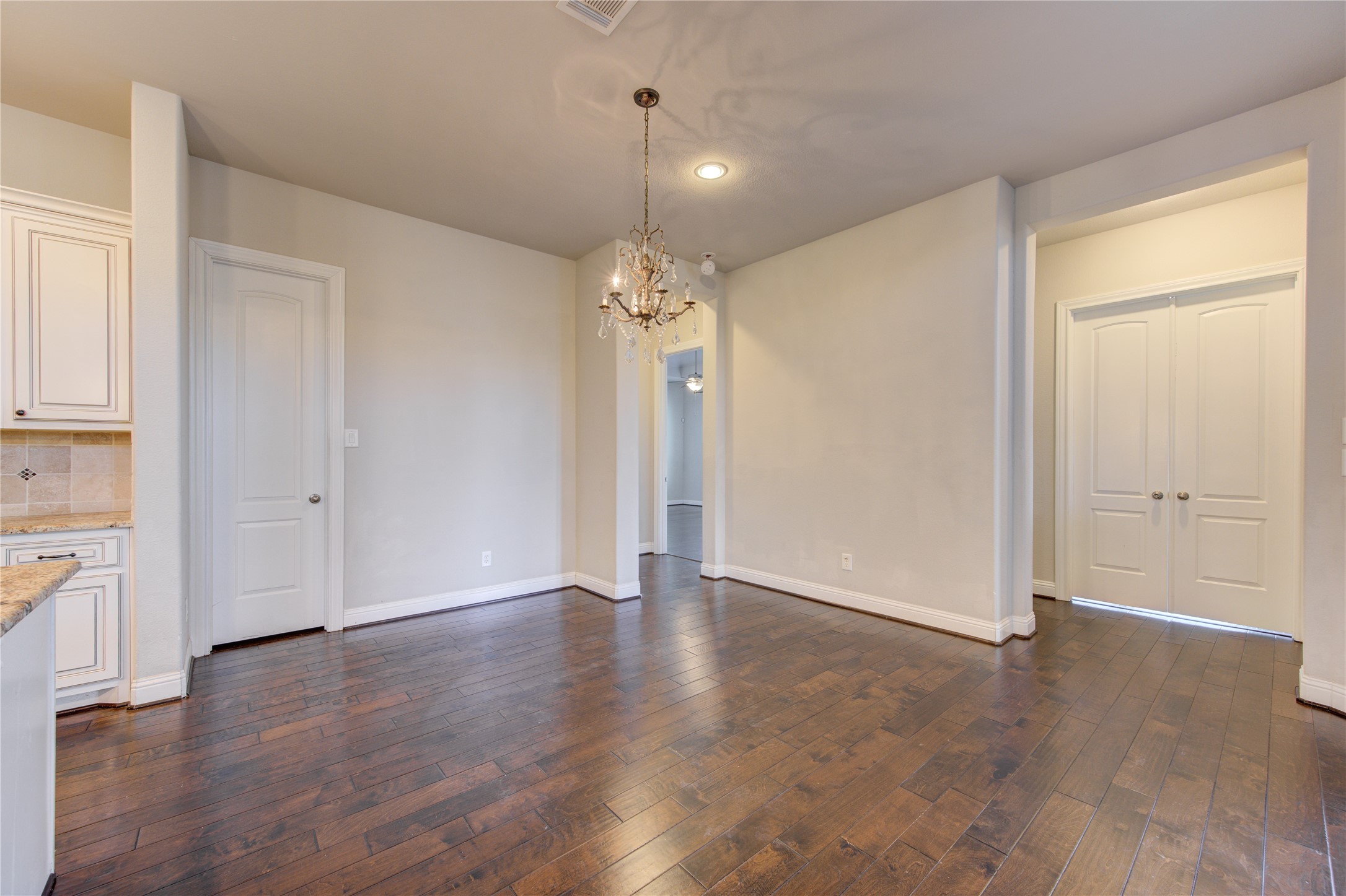 20411 Fawn Rest Place Spring, TX 77379 - Photo 23 of 50 an empty room with wooden floor and a window