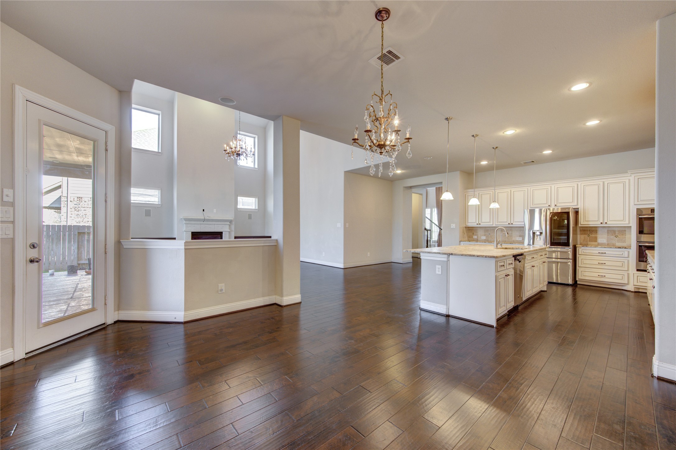 20411 Fawn Rest Place Spring, TX 77379 - Photo 24 of 50 a view of a kitchen with refrigerator and wooden floor