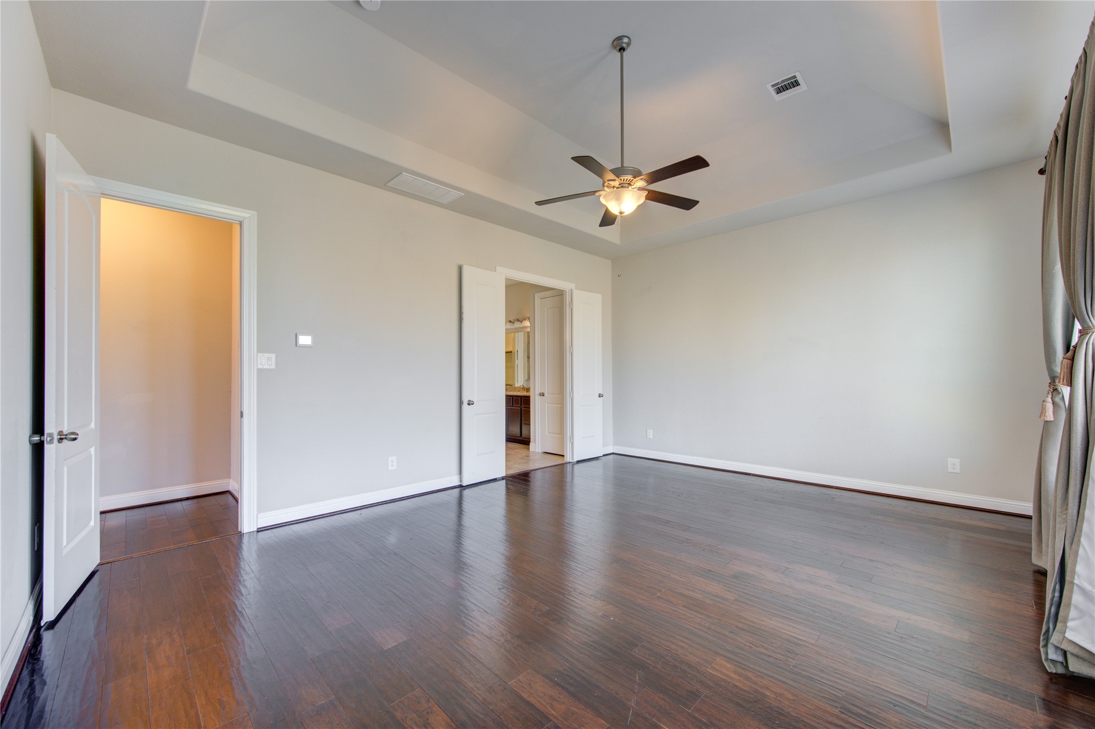 20411 Fawn Rest Place Spring, TX 77379 - Photo 26 of 50 an empty room with wooden floor chandelier fan and windows