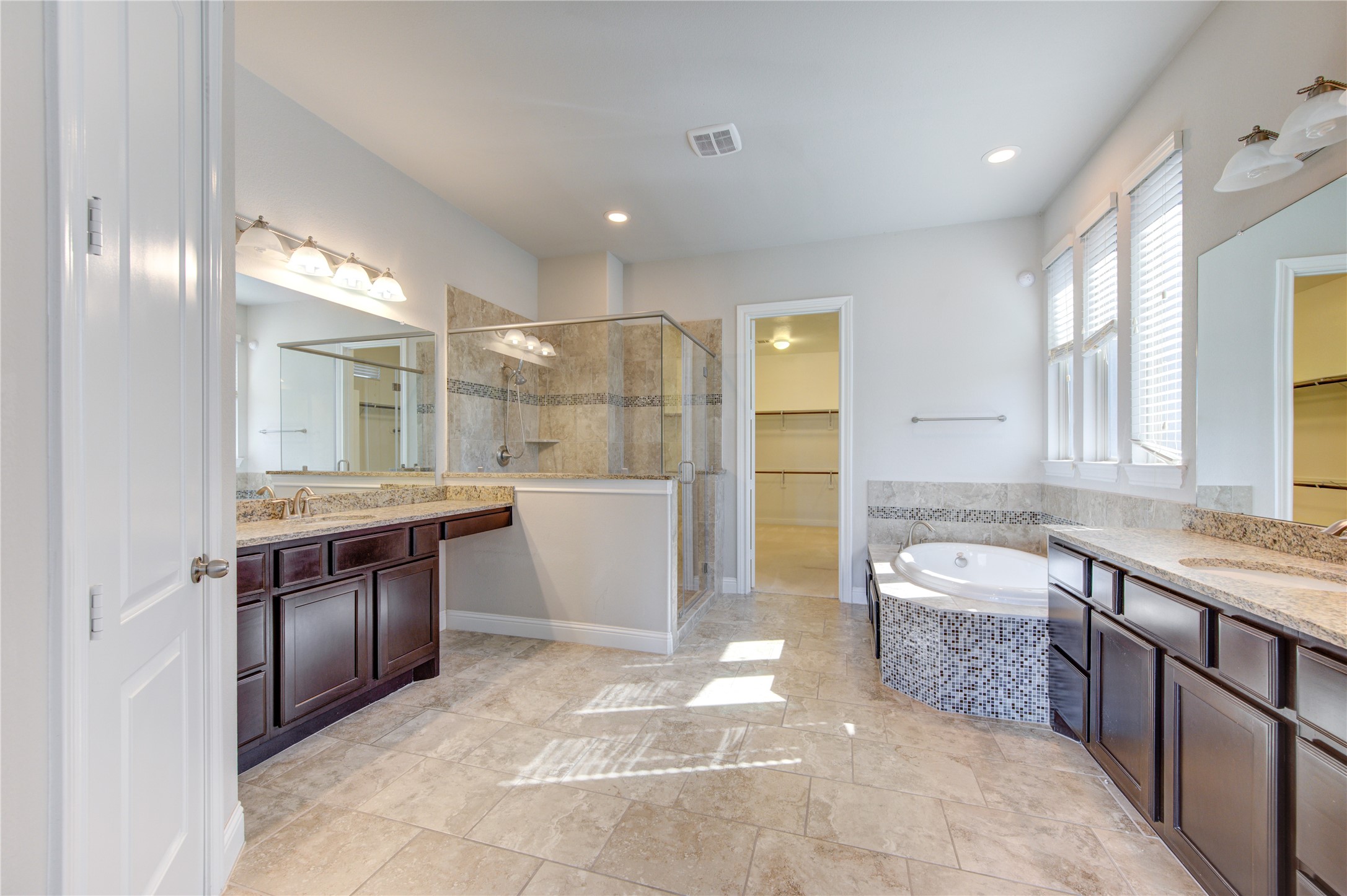 20411 Fawn Rest Place Spring, TX 77379 - Photo 29 of 50 a large bathroom with a granite countertop tub sink and a mirror