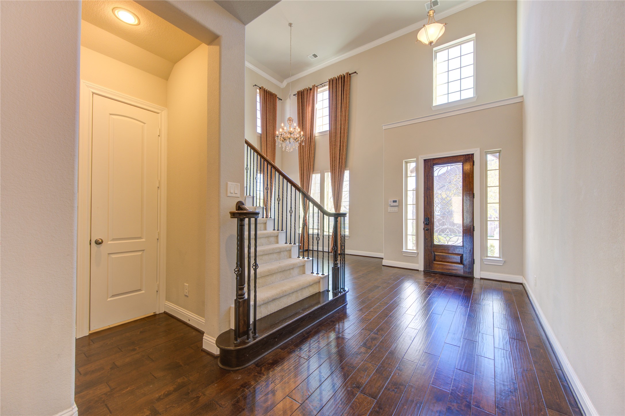 20411 Fawn Rest Place Spring, TX 77379 - Photo 3 of 50 a view of an entryway with wooden floor and door