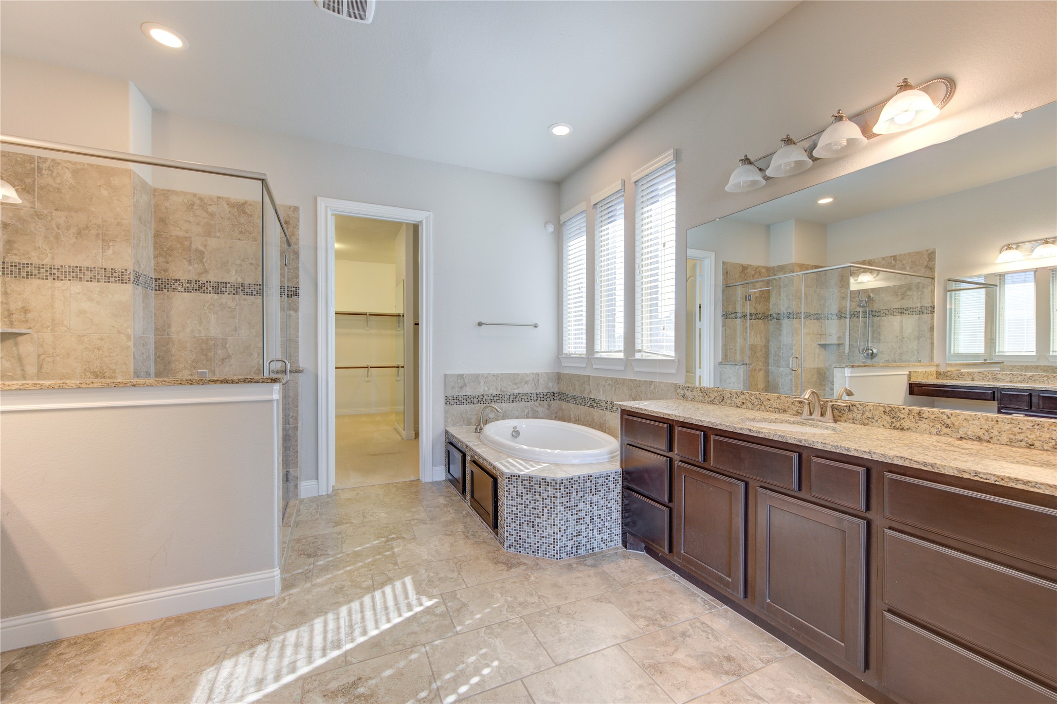 20411 Fawn Rest Place Spring, TX 77379 - Photo 31 of 50 a spacious bathroom with a tub sink and mirror