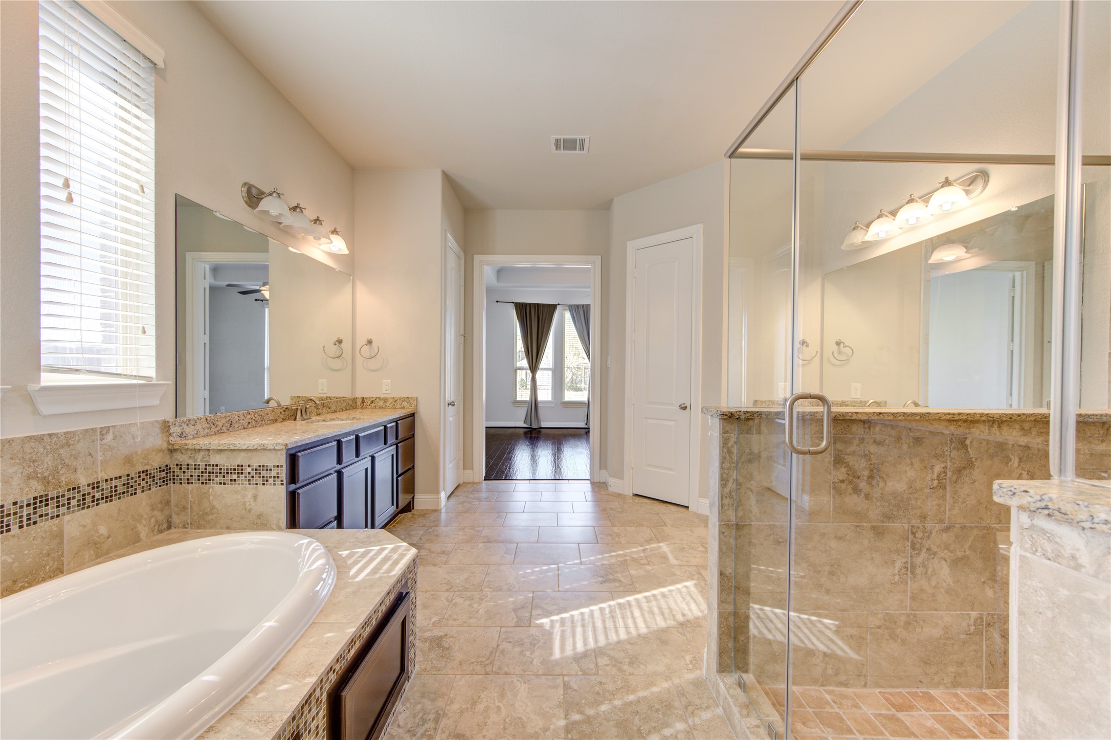 20411 Fawn Rest Place Spring, TX 77379 - Photo 32 of 50 a large spacious bathroom with a large tub shower and sink