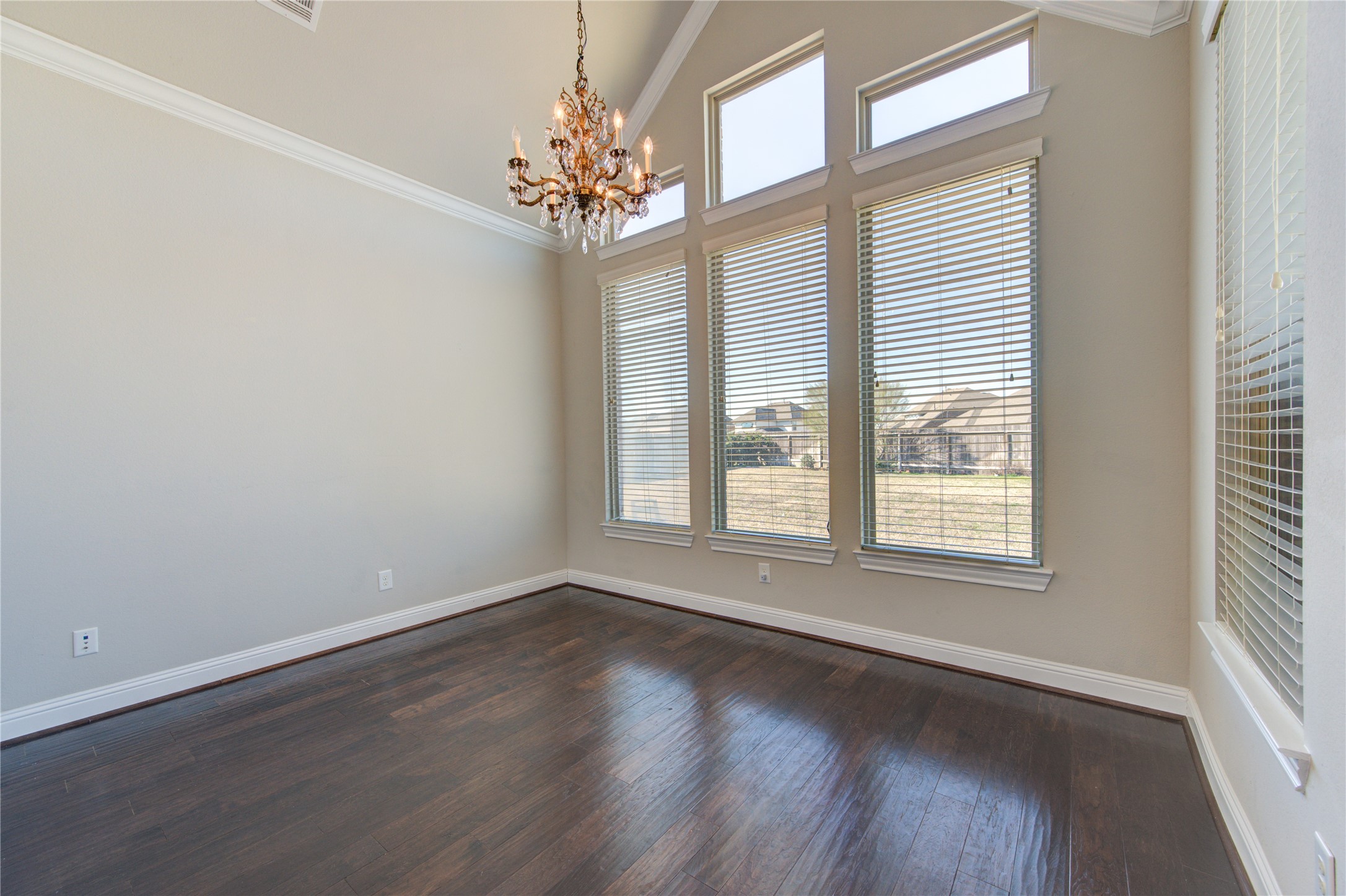 20411 Fawn Rest Place Spring, TX 77379 - Photo 34 of 50 a view of an empty room with wooden floor and a window