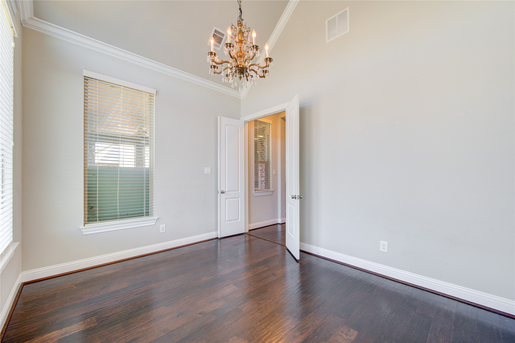 20411 Fawn Rest Place Spring, TX 77379 - Photo 35 of 50 an empty room with wooden floor and a window
