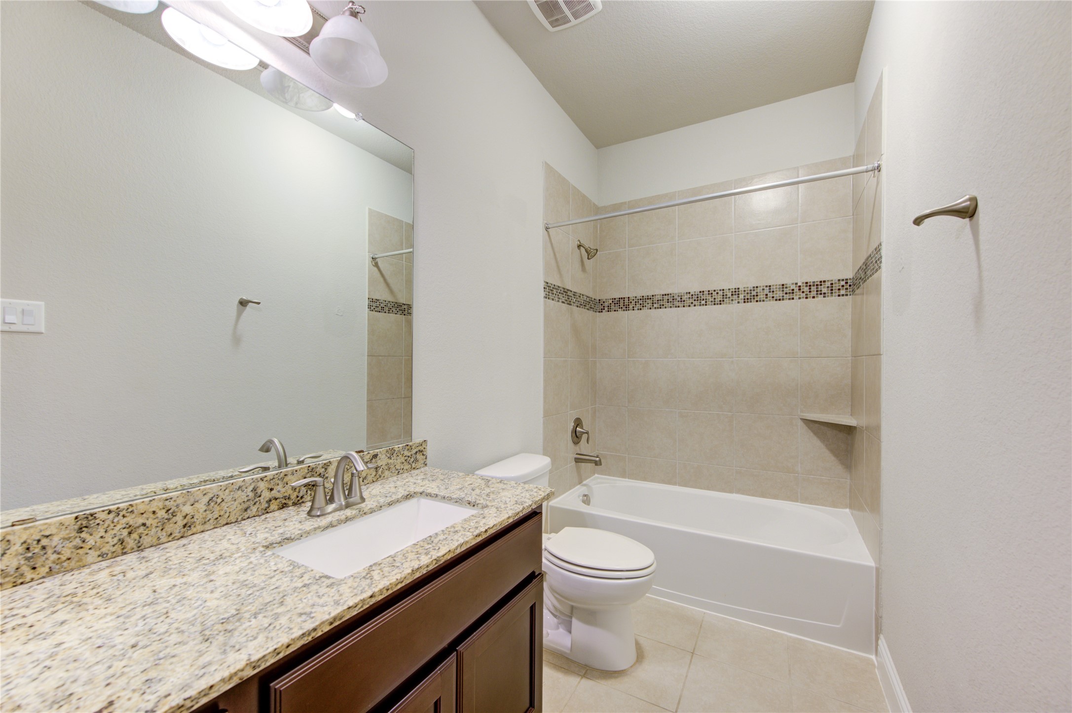 20411 Fawn Rest Place Spring, TX 77379 - Photo 38 of 50 a bathroom with a granite countertop sink a toilet and shower
