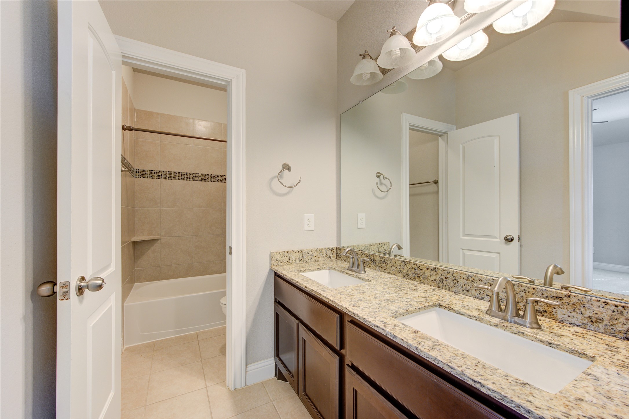 20411 Fawn Rest Place Spring, TX 77379 - Photo 43 of 50 a bathroom with a granite countertop sink a mirror and a shower