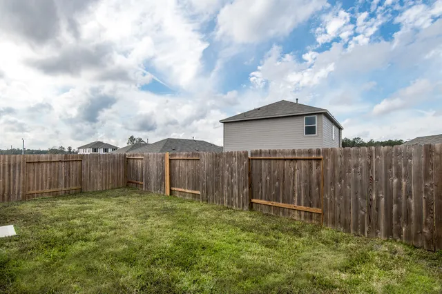 a backyard of a house with lots of green space
