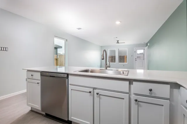 a view of a kitchen from the hallway