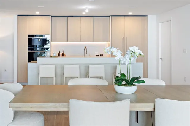 a living room with furniture and flowers