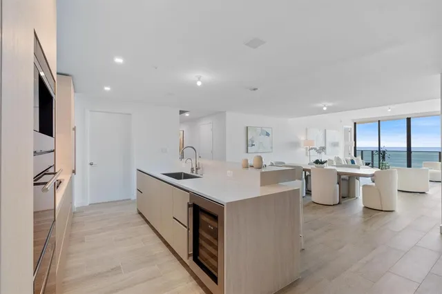 a kitchen with a sink stove and refrigerator