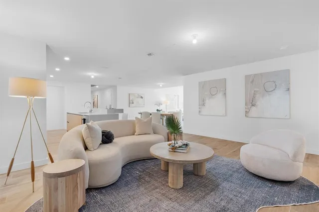 a living room with furniture and a table