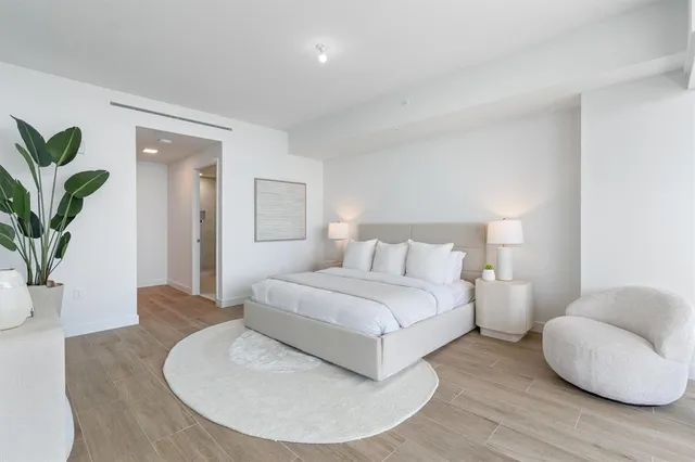 a bedroom with a bed and a couch