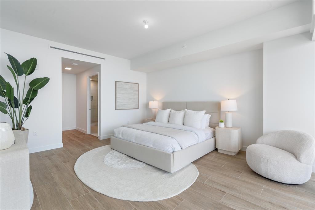 900 North Ocean Boulevard, Unit 1702 Pompano Beach, FL 33062 - Photo 25 of 49 a bedroom with a bed and a couch