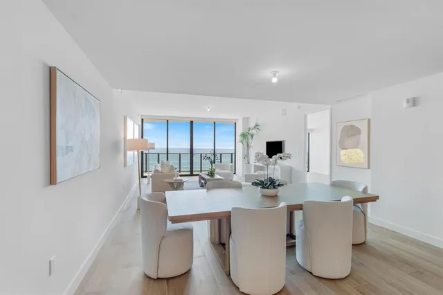 a dining room with table and chairs
