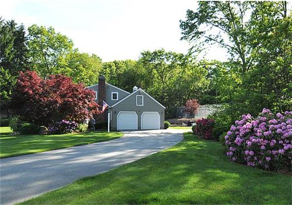 23 Whippletree Road Chelmsford, MA 01824 - Photo 2 of 28 a front view of a house with a garden