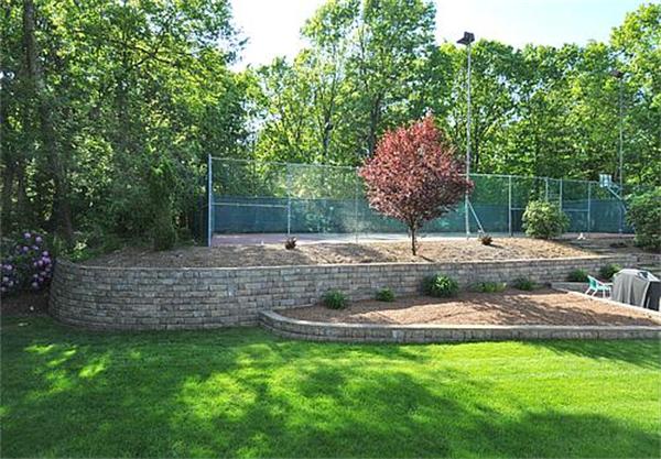 23 Whippletree Road Chelmsford, MA 01824 - Photo 4 of 28 a view of a garden with a bench