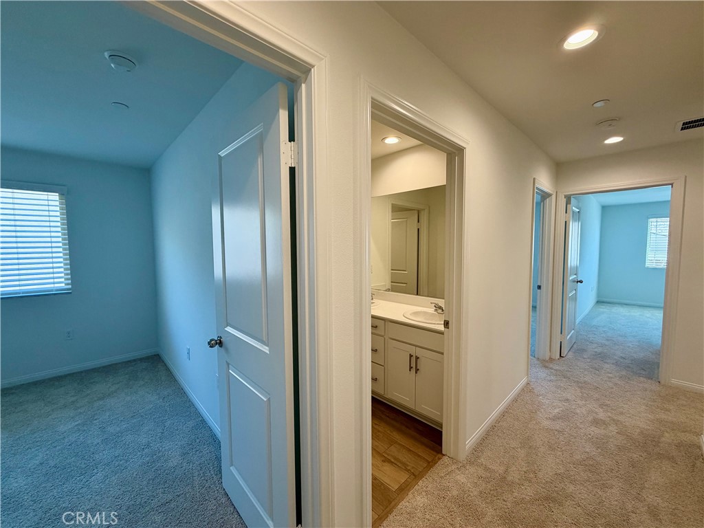 21624 Thomas Court Riverside, CA 92507 - Photo 15 of 36 a view of a hallway with closet and bathroom