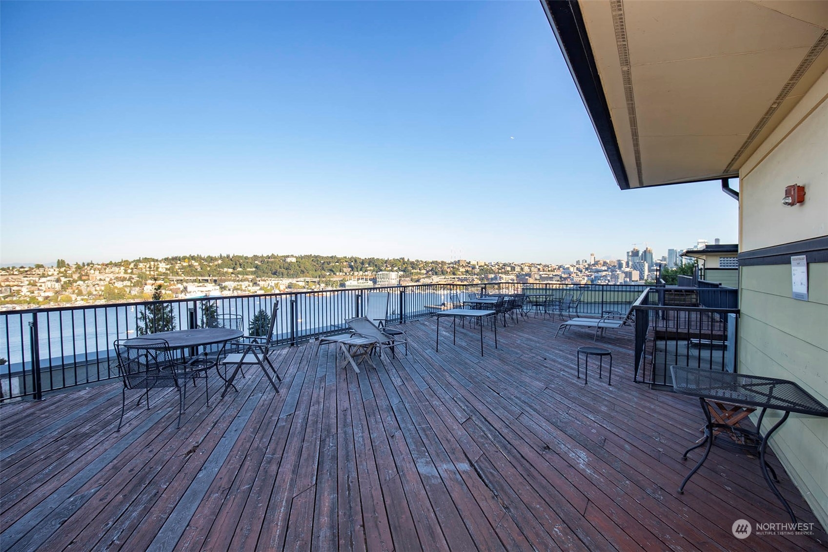 655 Crockett Street, Unit B304 Seattle, WA 98109 - Photo 25 of 35 a balcony with wooden floor and outdoor seating