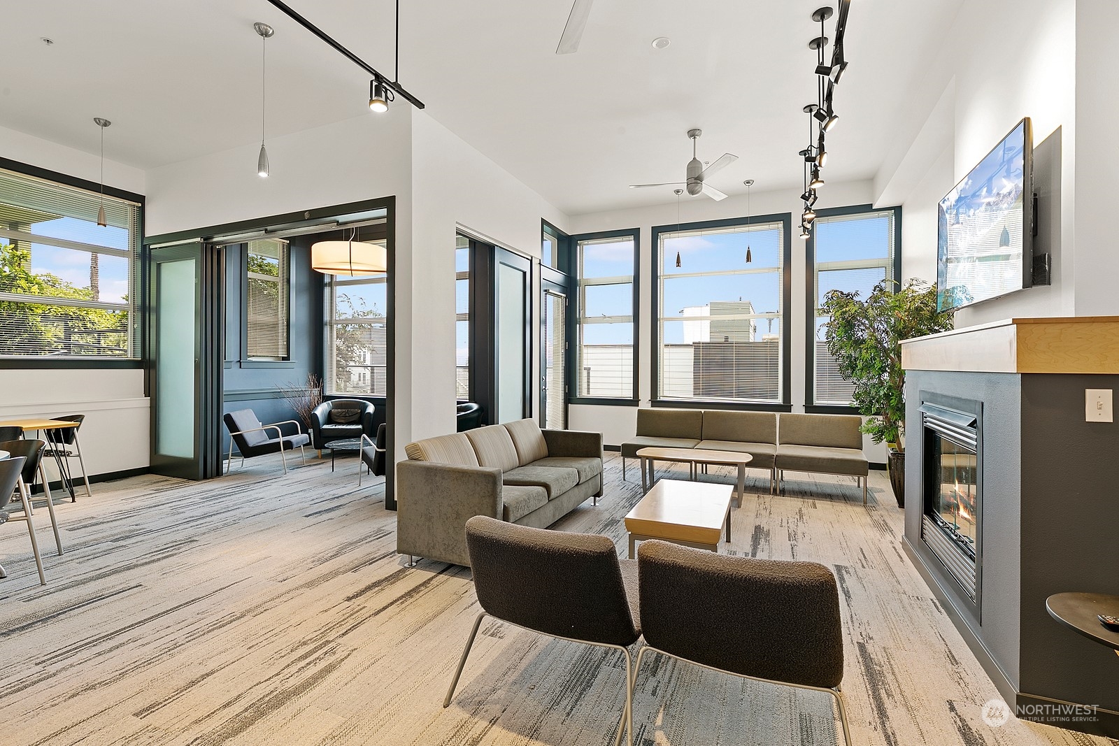 655 Crockett Street, Unit B304 Seattle, WA 98109 - Photo 31 of 35 a living room with furniture large windows and wooden floor