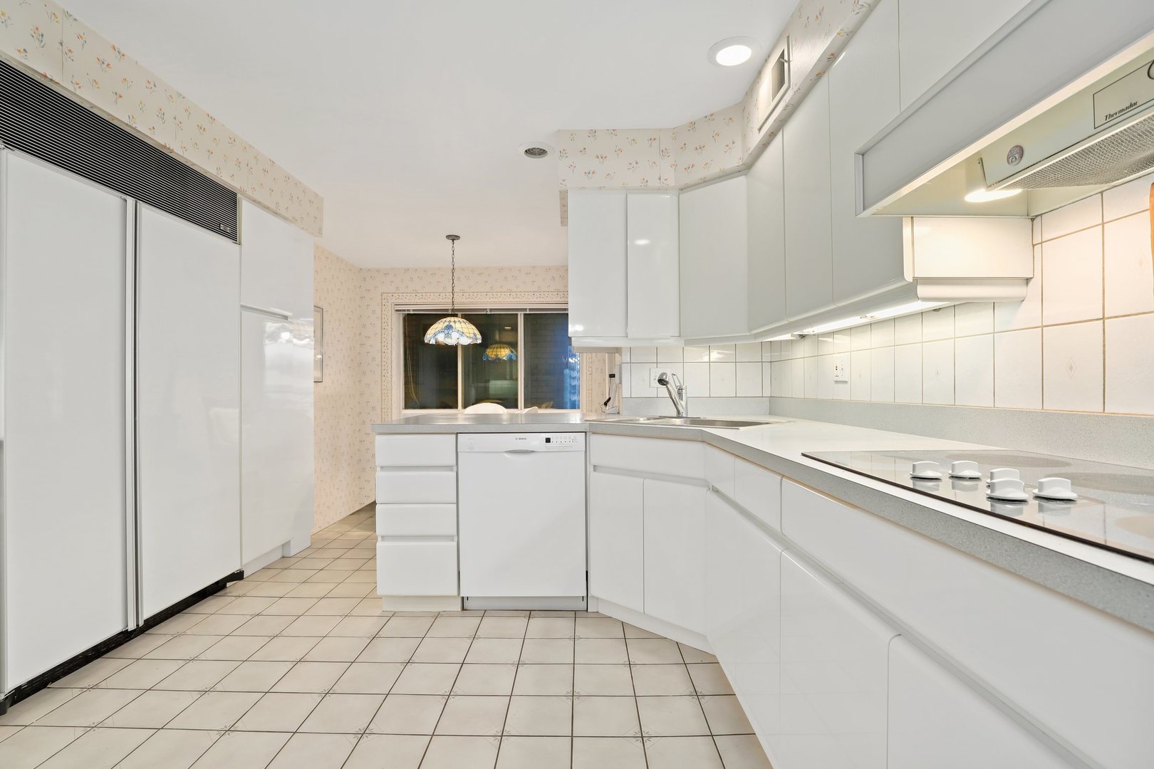 1 North Dee Road, Unit 2D Park Ridge, IL 60068 - Photo 15 of 38 a kitchen with white cabinets and appliances