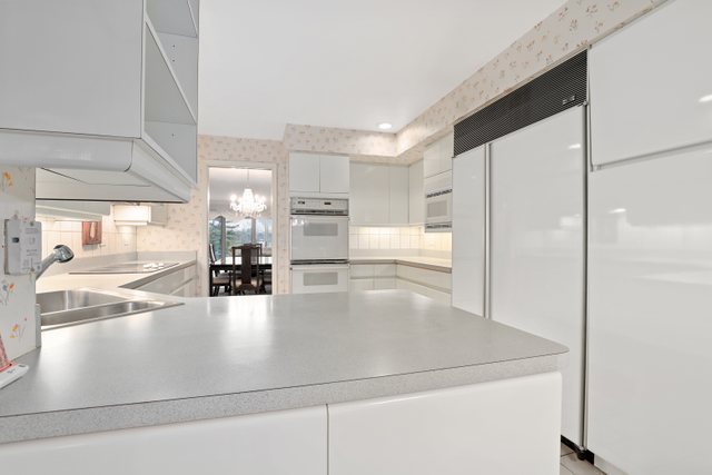 1 North Dee Road, Unit 2D Park Ridge, IL 60068 - Photo 17 of 38 a view of a kitchen with kitchen island a counter top space and appliances